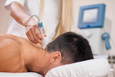 Patient receiving cold laser therapy for a neck injury